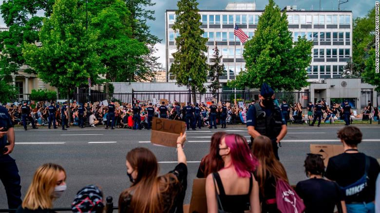 Crowds outside the US Embassy in Warsaw, Poland.