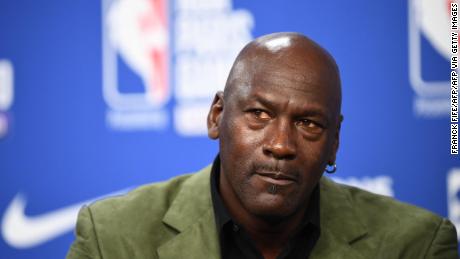 Michael Jordan addresses a press conference ahead of a game between Milwaukee Bucks and Charlotte Hornets.