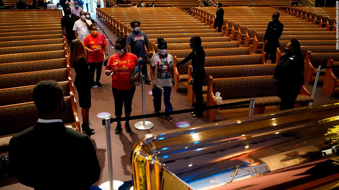 Ushers guide mourners into the church for Floyd&#39;s public visitation in Houston.