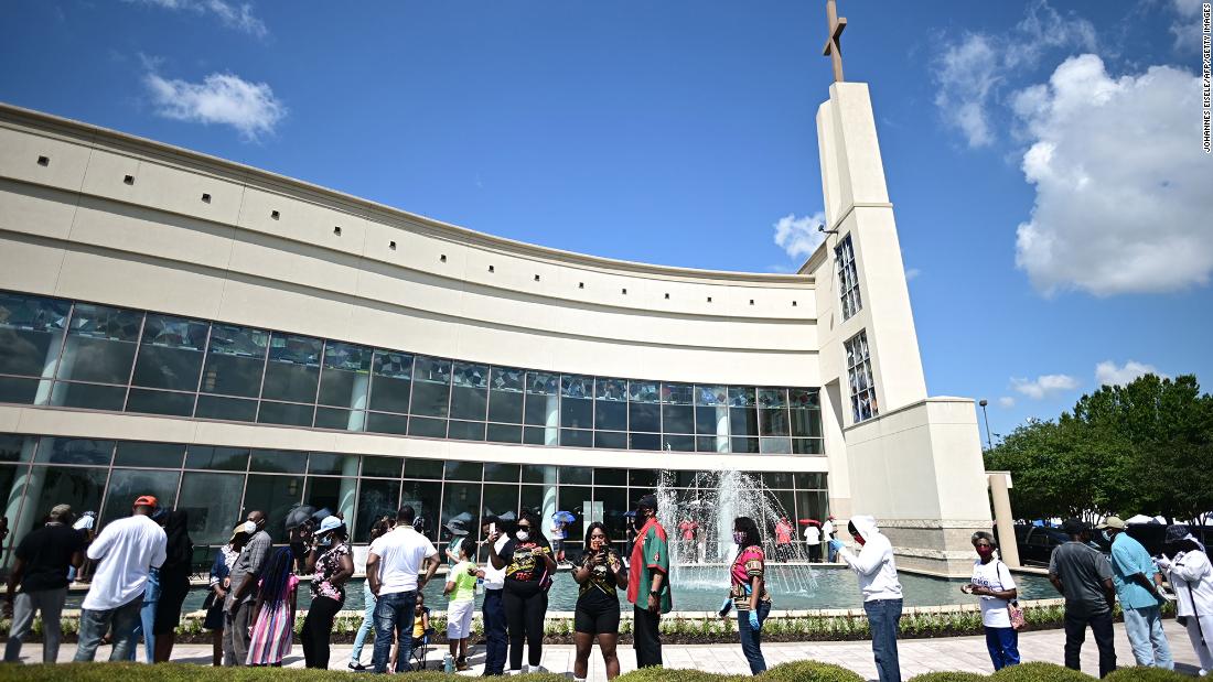 People line up to attend Floyd&#39;s public viewing in Houston. To comply with social-distancing rules, only 15 masked guests were allowed inside the church at a time. 