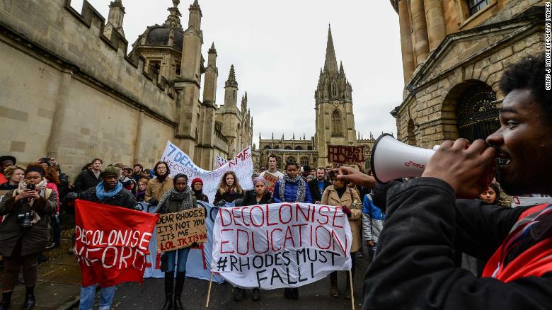 Students demonstrate outside Oxford University&#39;s All Souls College where a staute of Christopher Codrington is based which they are campaigning to be removed from the building on March 9, 2016 in Oxford, England. The demonstrators are calling for statues of colonial era figures including Cecil Rhodes and Queen Victoria to removed from university campuses. Cecil Rhodes was a british businessman and politician in South Africa, who served as Prime Minister of the Cape Colony from 1890 to 1896.  