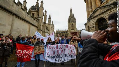 Students demonstrate outside Oxford University&#39;s All Souls College where a staute of Christopher Codrington is based which they are campaigning to be removed from the building on March 9, 2016 in Oxford, England. The demonstrators are calling for statues of colonial era figures including Cecil Rhodes and Queen Victoria to removed from university campuses. Cecil Rhodes was a british businessman and politician in South Africa, who served as Prime Minister of the Cape Colony from 1890 to 1896.  