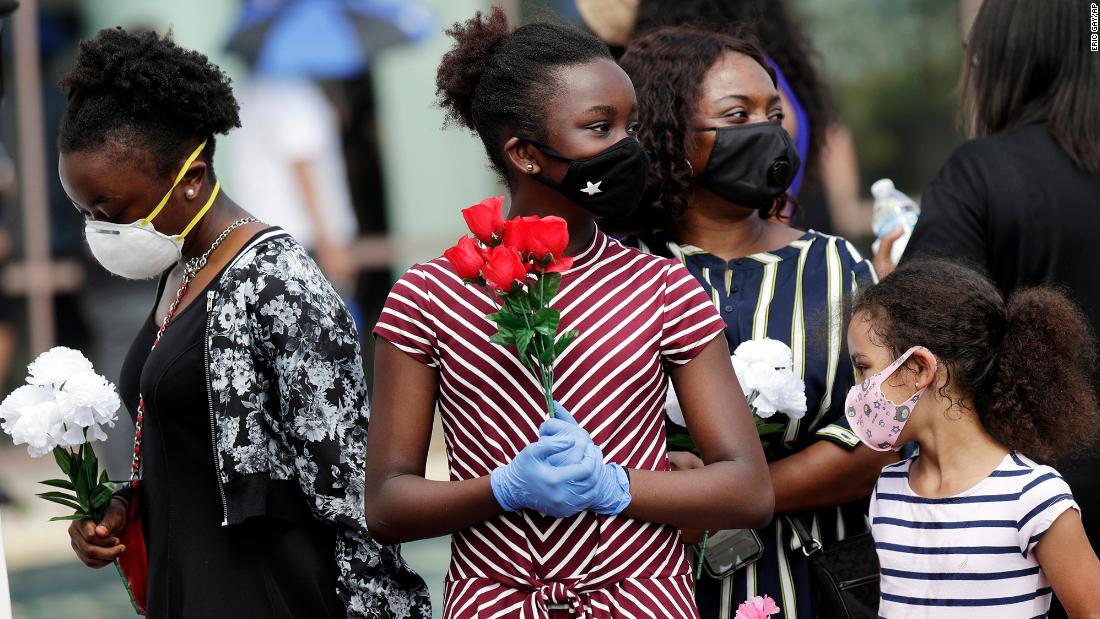 Mourners arrive at the Fountain of Praise church for Floyd&#39;s public visitation on Monday.