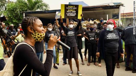 Demonstrators and activists from rights organizations protest in front of the Nigerian Police Force headquarters in Lagos.