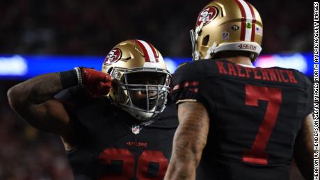 Carlos Hyde celebrates with Colin Kaepernick after scoring for the 49ers in September 2015.