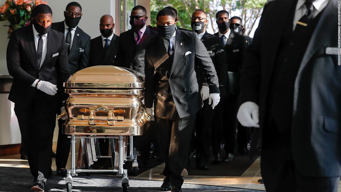 Pallbearers bring George Floyd&#39;s casket into the Fountain of Praise church in Houston on Tuesday, June 9. Floyd will be buried next to his mother, according to the Fort Bend Memorial Planning Center.