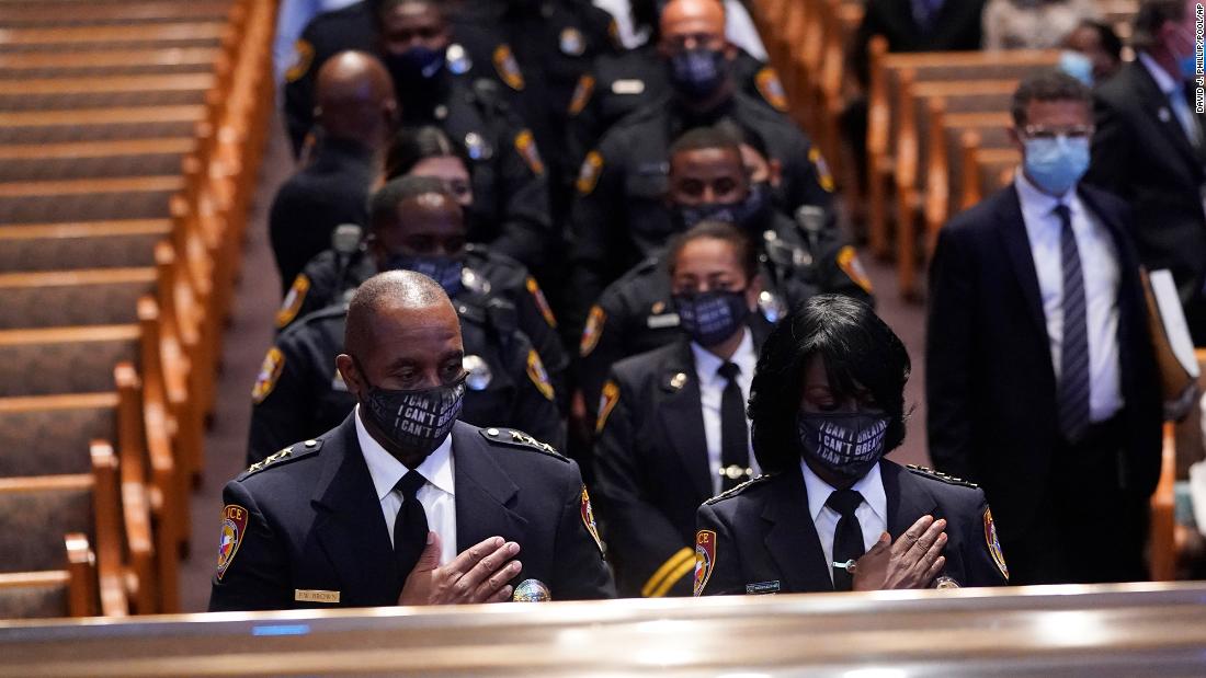 Members of the Texas Southern University Police Department pause during Floyd&#39;s funeral.