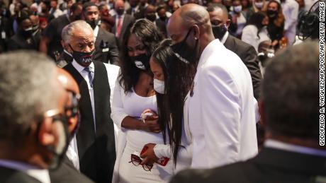 Family members react as they view the casket during the funeral of George Floyd on Tuesday at The Fountain of Praise church in Houston, Texas.