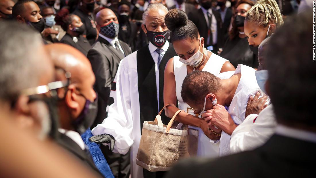 Mourners react as Floyd&#39;s extended family walks into his funeral service on Tuesday.