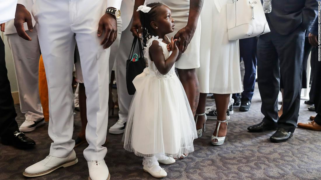 A young girl attends Floyd&#39;s funeral.