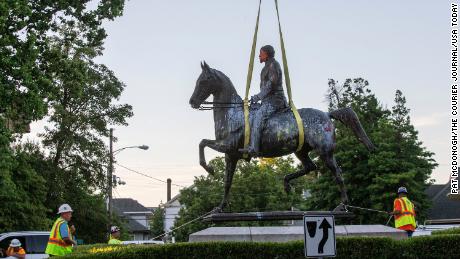 The John B. Castleman statue, in Louisville&#39;s Cherokee Triangle neighborhood, was removed from its pedestal where it stood for over 100 years. The statue to the controversial Castleman has been vandalized often over the last ten years. The statue is lifted off its base. June 8. 2020