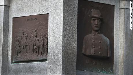 Plaques in honor of Confederates are seen on the base of a monument in Hemming Park.