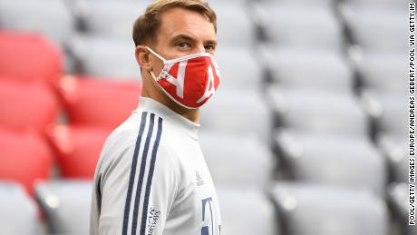 Manuel Neuer of FC Bayern Muenchen arrives at the stadium wearing a protective face mask prior to during the Bundesliga match between FC Bayern Muenchen and Eintracht Frankfurt at Allianz Arena on May 23, 2020 in Munich, Germany. 