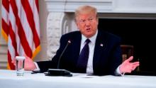 WASHINGTON, DC - JUNE 08: U.S. President Donald Trump makes remarks as he participates in a roundtable with law enforcement officials in the State Dining Room of the White House, June, 8, 2020 in Washington, DC. From L-R is Attorney General William Barr, Daniel J, Cameron Attorney General for the Commonwealth of Kentucky,  Trump. (Photo by Doug Mills-Pool/Getty Images)