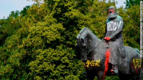TOPSHOT - A picture taken on June 10, 2020 shows the defaced statue of King Leopold II of Belgium in Brussels. - Statues of Leopold have long been a target of activists because of his record of brutal colonial rule in Belgium&#39;s former central African colonies. The movement has gained momentum in recent days after the latest US police killing of an unarmed black suspect triggered a global wave of protest. (Photo by kenzo tribouillard / AFP) (Photo by KENZO TRIBOUILLARD/AFP via Getty Images)