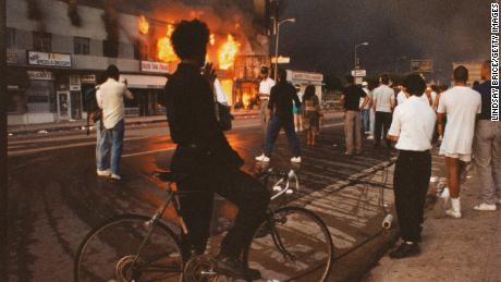 Businesses begin to burn on Pico Boulevard in Los Angeles during the Rodney King riots in 1992.