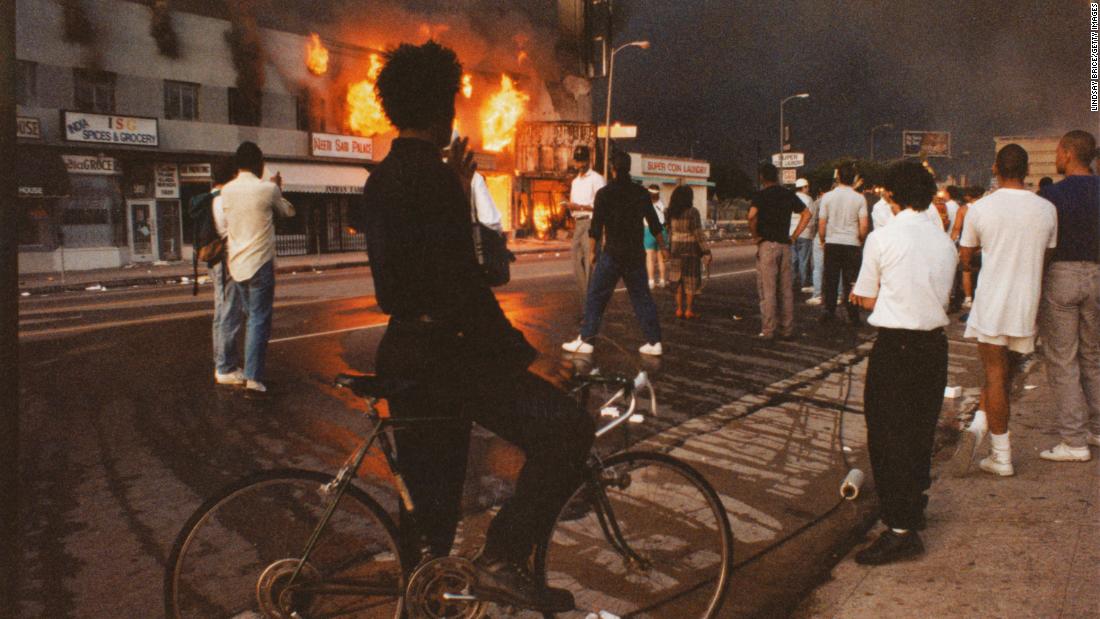 Businesses beginning to burn on Pico Boulevard during the Rodney King riots on April 30, 1992 in Los Angeles.