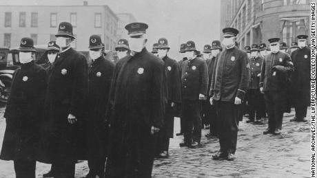 Policemen in Seattle wearing protective gauze face masks during the influenza epidemic of 1918 which claimed millions of lives worldwide