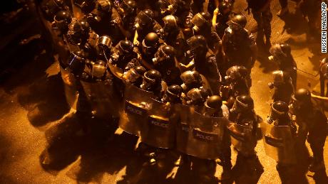 Riot police advance in downtown Beirut, Lebanon on June 11, 2020.