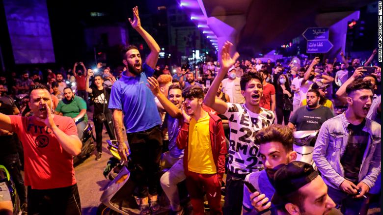 Protesters chant slogans  in the Lebanese capital Beirut&#39;s southern suburb late on June 11, 2020. 