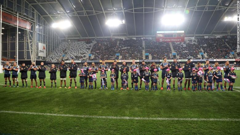 The Otago Highlanders team line up before the start of the game at the Forsyth Barr Stadium in Dunedin, the first since Covid-19 restrictions were largely lifted in New Zealand.