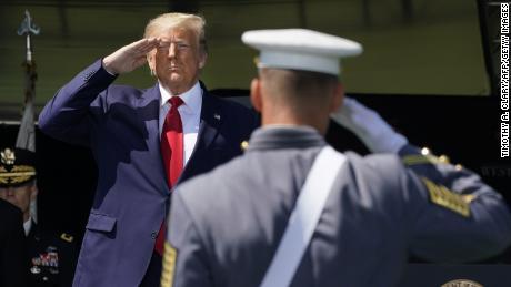 US President Donald Trump salutes as he arrives at the 2020 US Military Academy  graduation ceremony in West Point, New York, June 13, 2020. - Trump is delivering the commencement address at the 2020 US Military Academy Graduation Ceremony. The Military Academy will graduate more than 1,000 cadets at the in-person ceremony, with social distancing in place to preventing the transmission of the coronavirus.