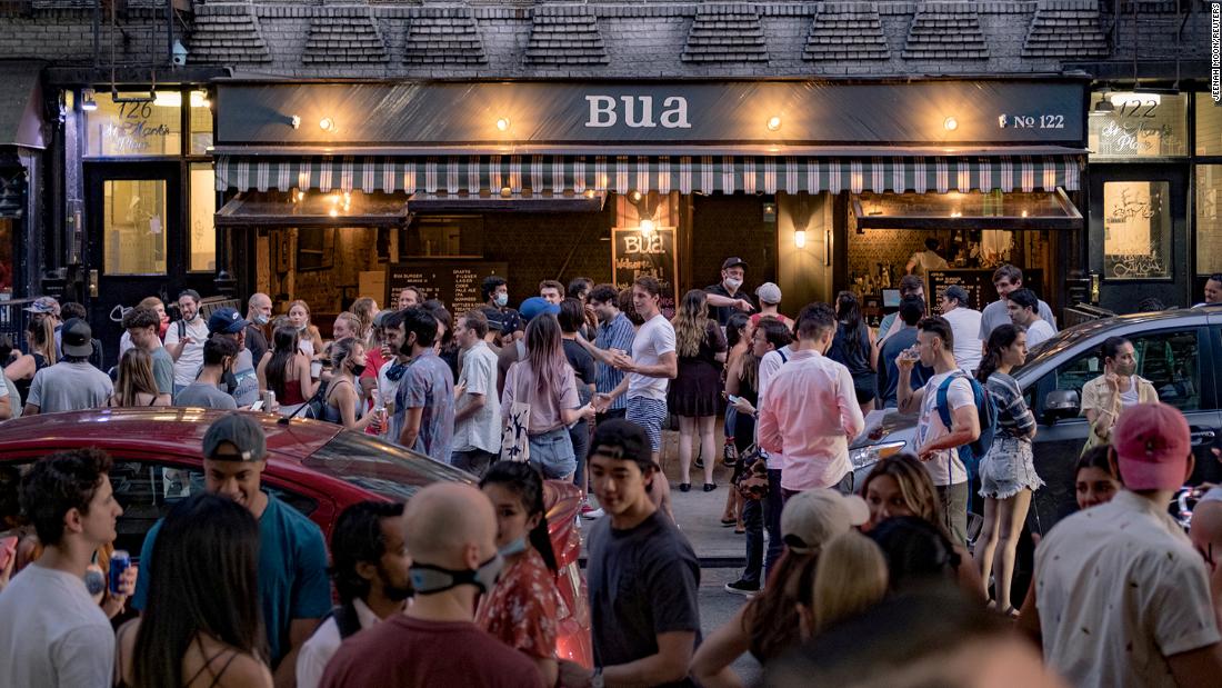 People drink outside a bar in New York City&#39;s East Village on June 12. Bars in the city were not allowed to open yet, but many people in New York took to the streets after the city &lt;a href=&quot;https://www.cnn.com/interactive/2020/06/us/new-york-coronavirus-reopening-cnnphotos/index.html&quot; target=&quot;_blank&quot;&gt;entered Phase One of its reopening plan&lt;/a&gt; on June 8.