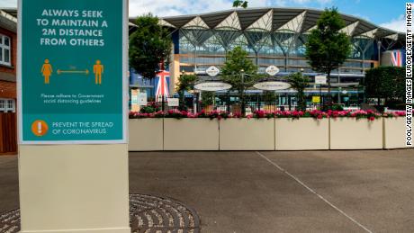 Social distancing signs are seen inside Ascot Racecourse this year.