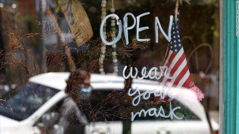 SAN FRANCISCO, CALIFORNIA - JUNE 16: A pedestrian walks by a retail store that has reopened on June 16, 2020 in San Francisco, California. According to a report by the U.S. Commerce Department, retail sales surged 17.7 percent in May as more states begin the process of reopening after being shut down due to the coronavirus COVID-19 pandemic. (Photo by Justin Sullivan/Getty Images)