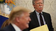 Then National Security Adviser John Bolton listens to U.S. President Donald Trump speak during a meeting with Egyptian President Abdel-Fattah el-Sisi in the Oval Office of the White House April 9, 2019 in Washington, DC. 