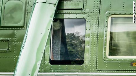 First lady Melania Trump wears a face mask as she sits aboard Marine One with President Donald Trump before they depart from the South Lawn of the White House in Washington, Wednesday, May 27, 2020, for a short trip to Andrews Air Force Base, Maryland.