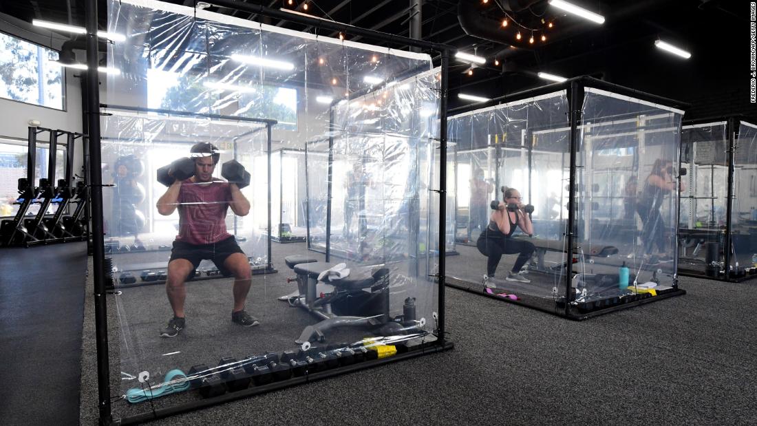 People exercise in workout pods at Inspire South Bay Fitness, a gym in Redondo Beach, California, on June 15.