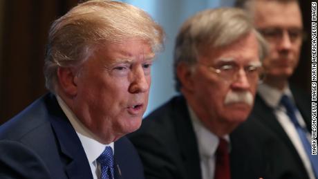 WASHINGTON, DC - APRIL 09:  U.S. President Donald Trump is flanked by National Security Advisor John Bolton as he speaks about the FBI raid at his lawyer Michael Cohen&#39;s office, while receiving a briefing from senior military leaders regarding Syria,  in the Cabinet Room, on April 9, 2018 in Washington, DC. The FBI raided the office of Michael Cohen on Monday as part of the ongoing investigation into the president&#39;s administration. (Photo by Mark Wilson/Getty Images)
