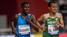 Mohammed competes in the 5000m heats of the World Athletics Championships in Doha