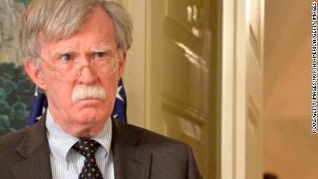 WASHINGTON, DC - APRIL 13: National Security Advisor John Bolton listens to remarks by U.S. President Donald Trump as he speaks to the nation, announcing military action against Syria for the recent apparent gas attack on its civilians, at the White House, on April 13, 2018, in Washington, DC. President Trump announced that a joint operation of "precision strikes" is underway in Syria with armed forces from the United Kingdom and France.  (Photo by Mike Theiler - Pool/Getty Images)