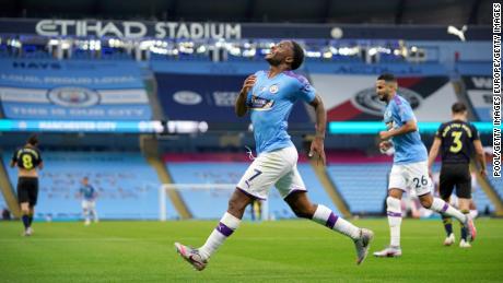 Raheem Sterling celebrates after scoring his team&#39;s first goal against Arsenal.