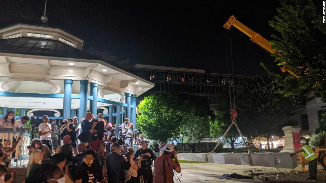 Protesters tear down statues from Confederate monuments in DC and North Carolina