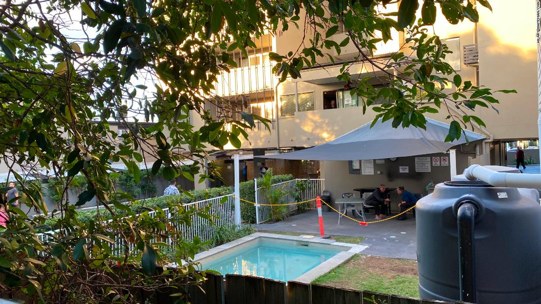 Temporary fences have been erected around the hotel, but the neighbors can see into the hotel grounds from their kitchen.