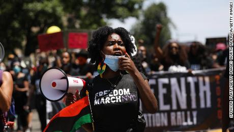 NEW YORK, NEW YORK - JUNE 19: People participate in a march in Brooklyn for both Black Lives Matter and to commemorate the 155th anniversary of Juneteenth on June 19, 2020 in New York City. Juneteenth commemorates June 19, 1865, when a Union general read orders in Galveston, Texas stating all enslaved people in Texas were free according to federal law. As the nation comes to terms from a number of recent killings of black Americans by police, Juneteenth is being celebrated and recognized throughout the country in marches, memorials and services. (Photo by Spencer Platt/Getty Images)