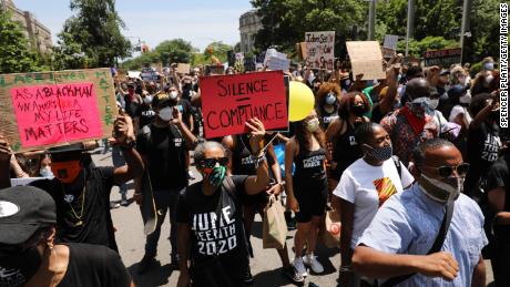 People participate in a march in Brooklyn for both Black Lives Matter and to commemorate the 155th anniversary of Juneteenth on June 19, 2020 in New York City.
