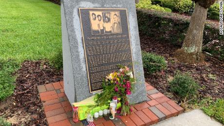  A tribute to  George Floyd rests on the memorial erected for the Groveland Four at the Old Lake County  Courthouse.