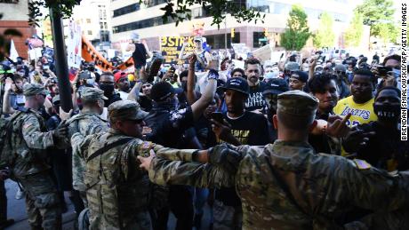 Members of the National Guard formed a barrier to stop protesters near the Bank of Oklahoma Center in Tulsa.