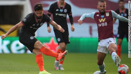 Chelsea&#39;s French striker Olivier Giroud scores his team&#39;s winning goal as his shot takes a deflection off the boot of the challenging Conor Hourihane to beat Orjan Nyland in the Aston Villa goal. 