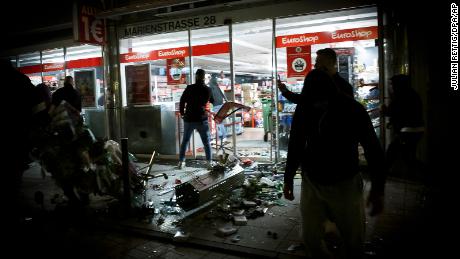 Hundreds of rioters in small groups looted stores and clashed with police in Stuttgart.