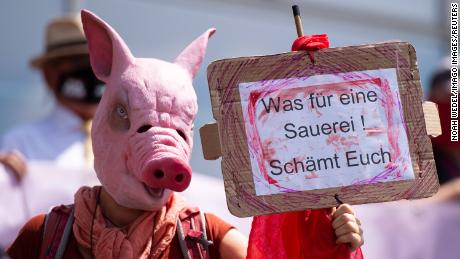 A demonstration at a news conference over the outbreak at Toennies meat processing plant in Guetersloh.