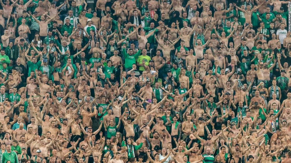 Fans of the Hungarian soccer club Ferencvarosi TC attend a match in Budapest on June 20.