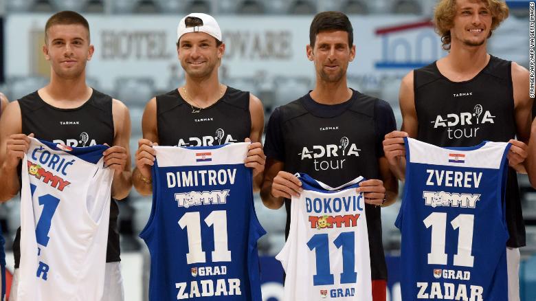 This photograph taken on June 18, 2020, shows (L/R):Croatia&#39;s Borna Coric, Bulgaria&#39;s Grigor Dimitrov, Serbia&#39;s Novak Djokovic and Germany&#39;s Alexander Zverev, tennis players as they pose for a group photograph ahead of an exhibition basketball match in Zadar. - Croatia&#39;s Borna Coric announced on June 22, 2020, that he has become the second player to test positive for coronavirus after taking part in an exhibition tournament in Croatia featuring world number one Novak Djokovic. &quot;Hi everyone, I wanted to inform you all that I tested positive for COVID-19,&quot; the Croatian, ranked 33rd in the world, posted on Twitter. It follows the June 21, announcement by Grigor Dimitrov that he had also tested positive after pulling out of the exhibition event, which is one of the biggest since the tennis season was halted because of the pandemic. (Photo by STRINGER / AFP) / Croatia OUT (Photo by STRINGER/AFP via Getty Images)