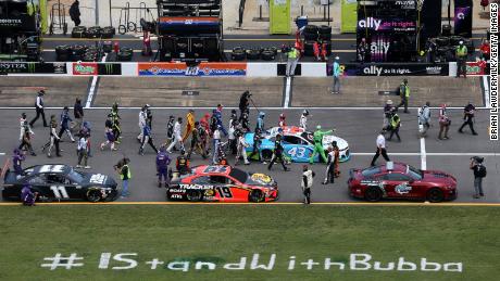 NASCAR drivers push the #43 Victory Junction Chevrolet, driven by Bubba Wallace, to the front of the grid as a sign of solidarity prior to the NASCAR Cup Series GEICO 500 at Talladega Superspeedway on June 22, 2020 in Talladega, Alabama.