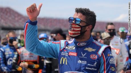 TALLADEGA, ALABAMA - JUNE 22:  Bubba Wallace, driver of the #43 Victory Junction Chevrolet, gives a thumbs up prior to the NASCAR Cup Series GEICO 500 at Talladega Superspeedway on June 22, 2020 in Talladega, Alabama. A noose was found in the garage stall of NASCAR driver Bubba Wallace at Talladega Superspeedway a week after the organization banned the Confederate flag at its facilities. (Photo by Chris Graythen/Getty Images)