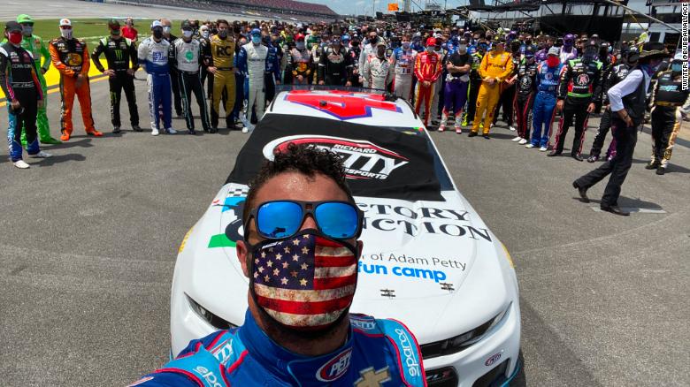 Watch NASCAR drivers, pit crews stand with Bubba Wallace